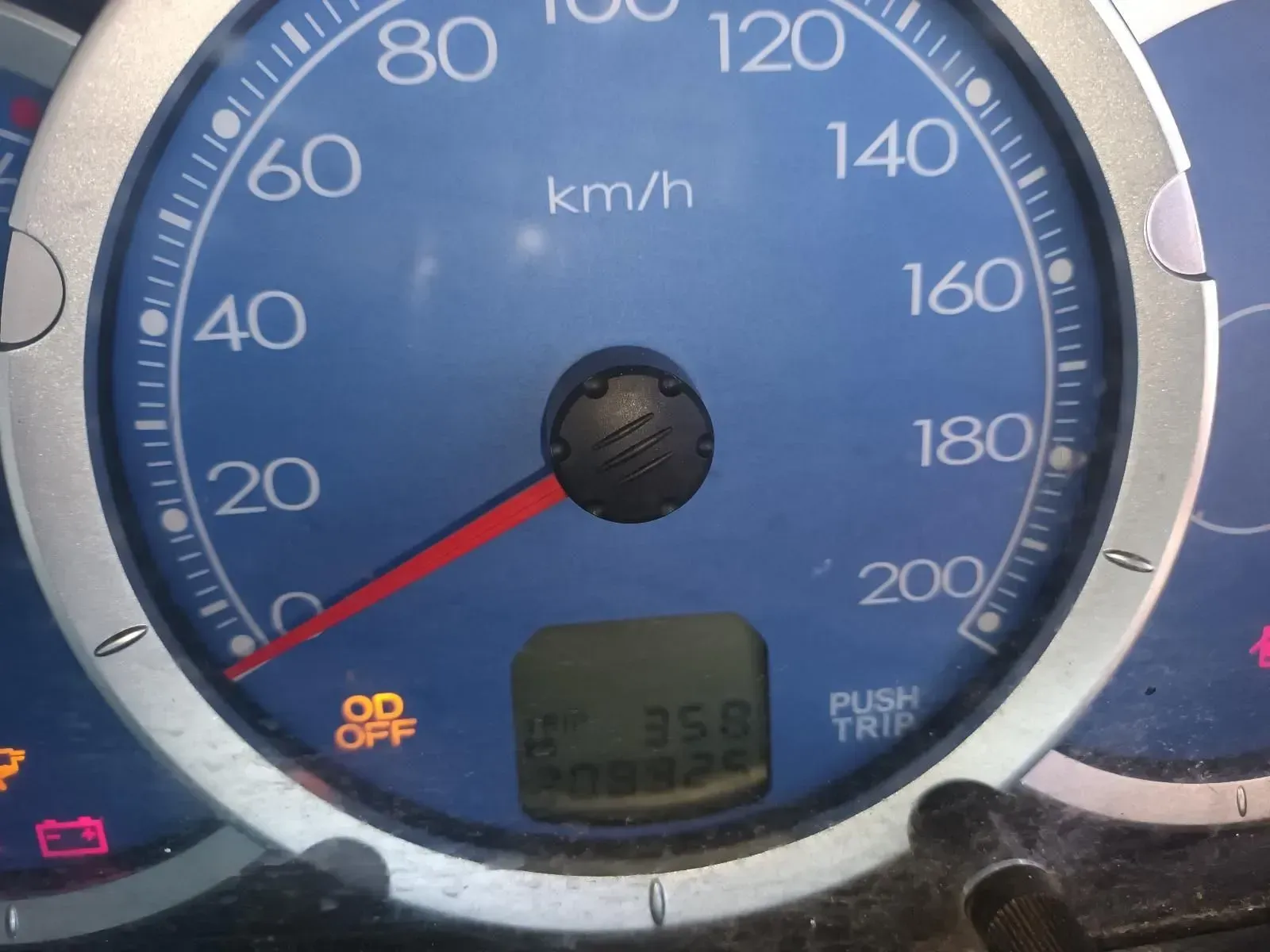 Car Speedometer Showing a Speed of 58 Km/h, Odometer, and Warning Lights — South West 4WD Wreckers In Brisbane, QLD