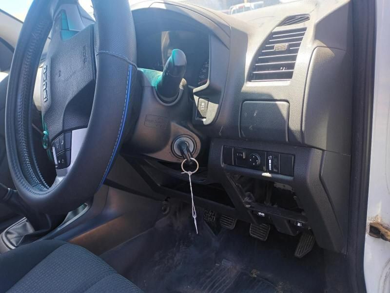 The Interior of a White Car With a Key in the Ignition — South West 4WD Wreckers In Brisbane, QLD