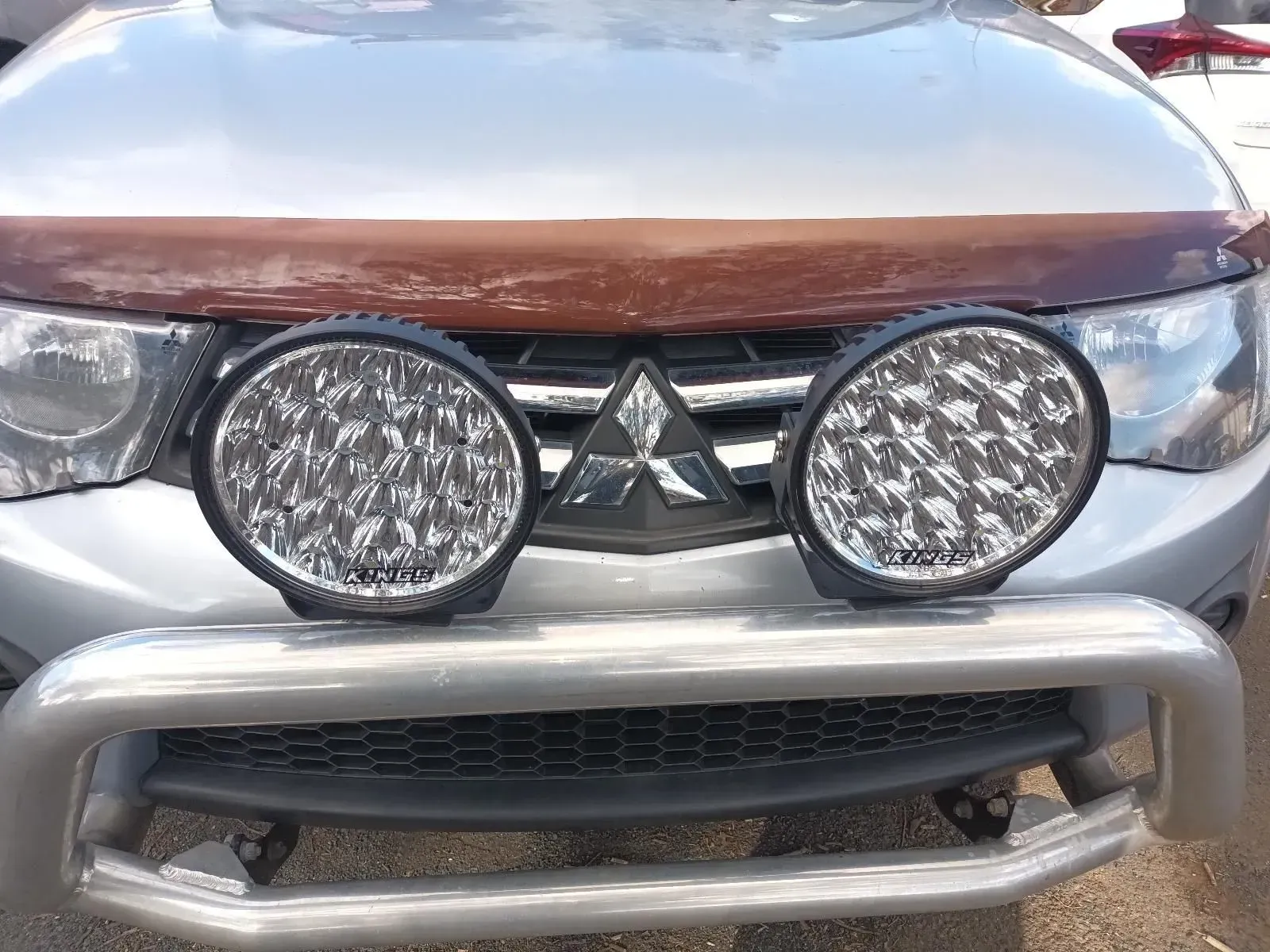 Silver Car With Two Large Round Spotlights Mounted on a Front Bull Bar — South West 4WD Wreckers In Brisbane, QLD