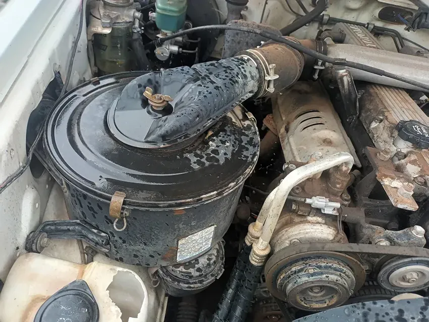 A Close Up of a Car Engine With a Dirty Air Filter — South West 4WD Wreckers In Brisbane, QLD
