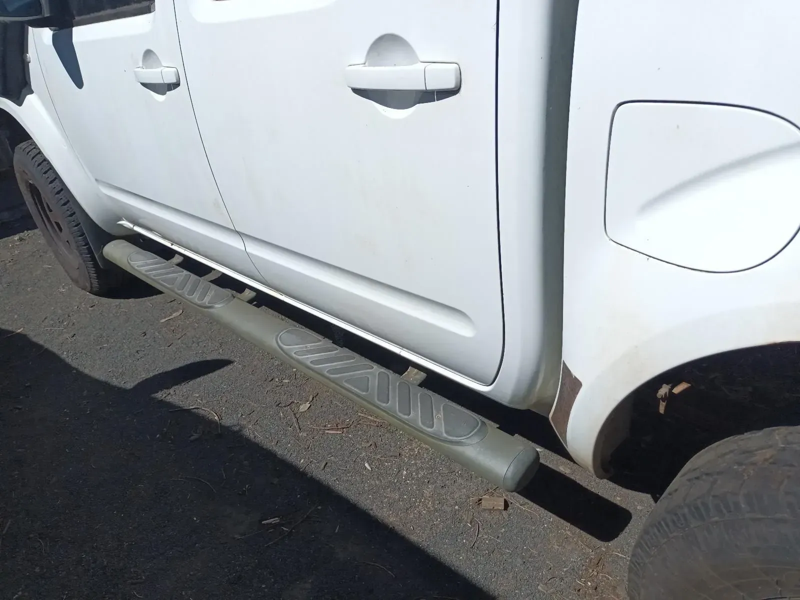 White Truck With Gray Running Boards on a Dark Asphalt Surface — South West 4WD Wreckers In Brisbane, QLD