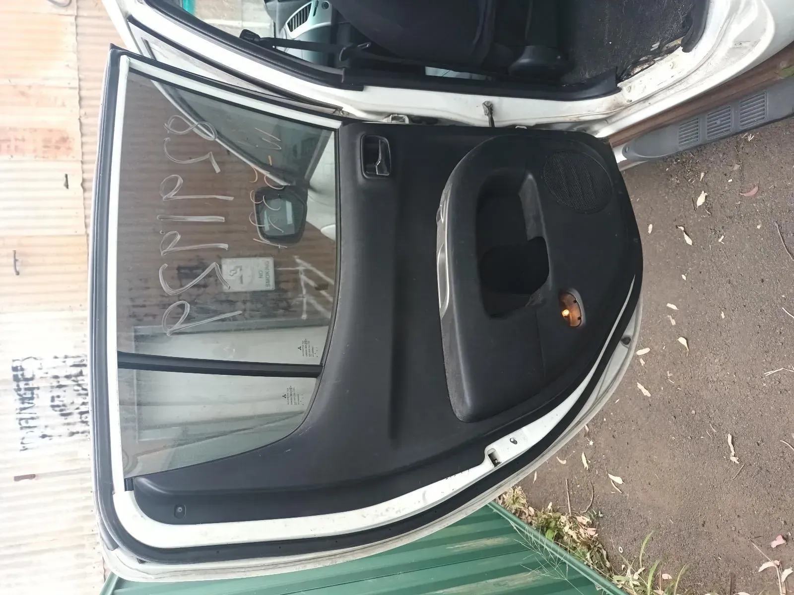 Open Car Door, Black Interior Panel, White Exterior, Reflective Window, Outdoors — South West 4WD Wreckers In Brisbane, QLD