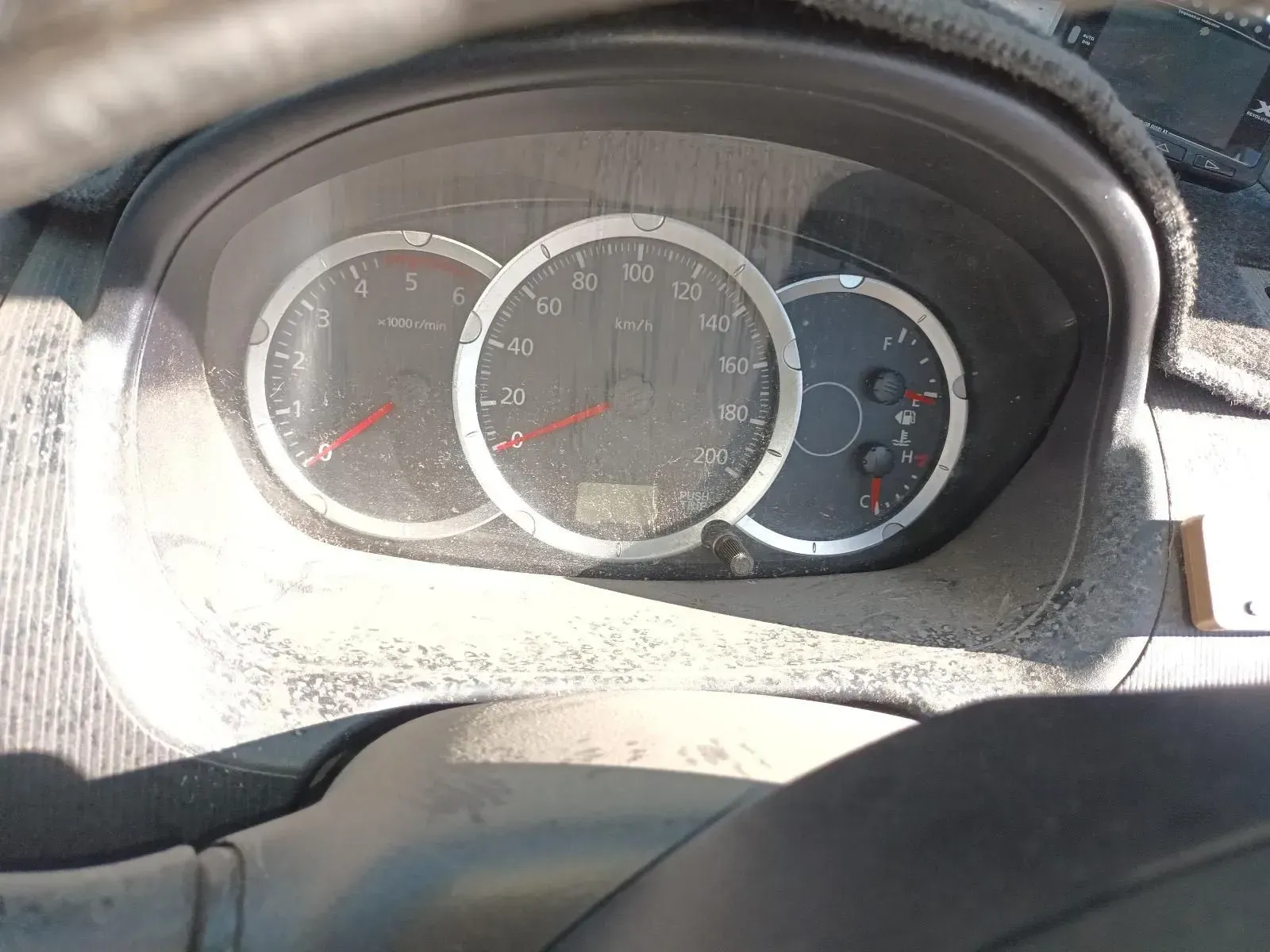 Car Dashboard Covered in Dust Showing Gauges for Rpm — South West 4WD Wreckers In Brisbane, QLD