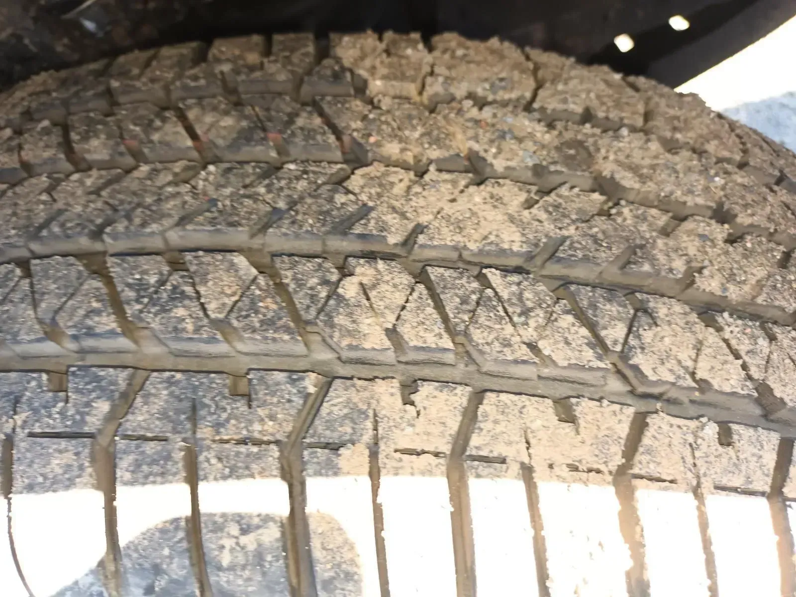 Close-up of a Dirty Tyre With Angled Tread — South West 4WD Wreckers In Brisbane, QLD