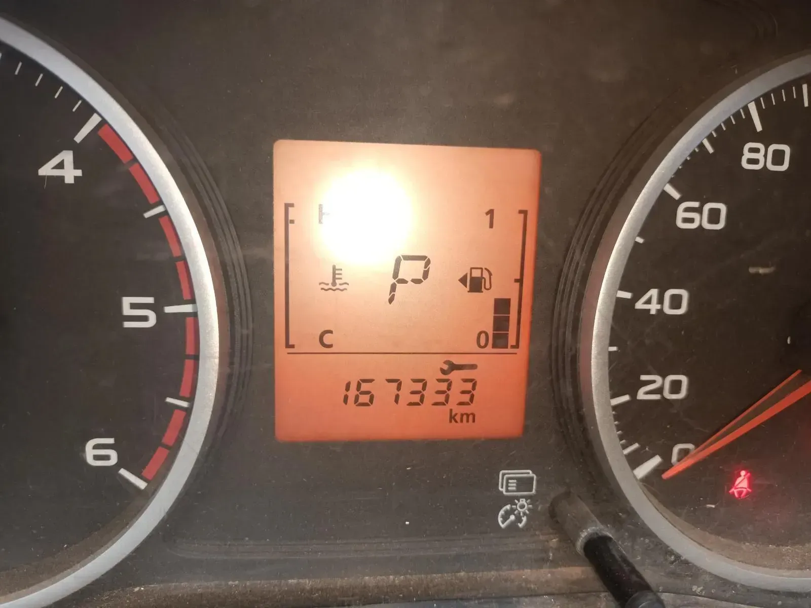 Dashboard With Odometer Reading 167333 Km, and a Warning Light — South West 4WD Wreckers In Brisbane, QLD