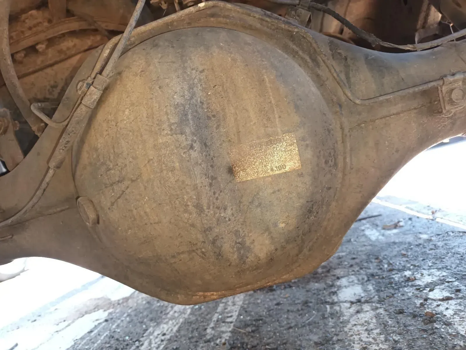 Underside View of a Dirty, Metallic Vehicle Rear Differential With a Central Bulge — South West 4WD Wreckers In Brisbane, QLD