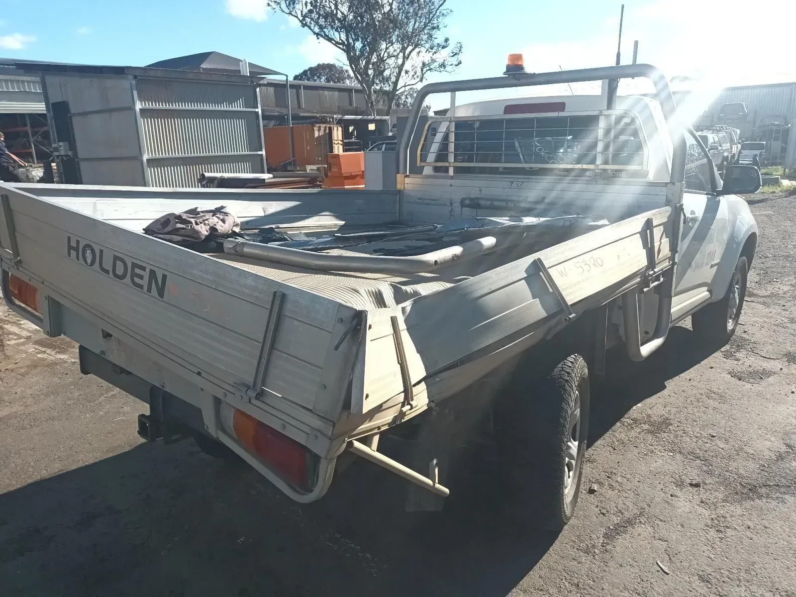 White Holden Utility Truck With a Flatbed, Parked Outside — South West 4WD Wreckers In Brisbane, QLD