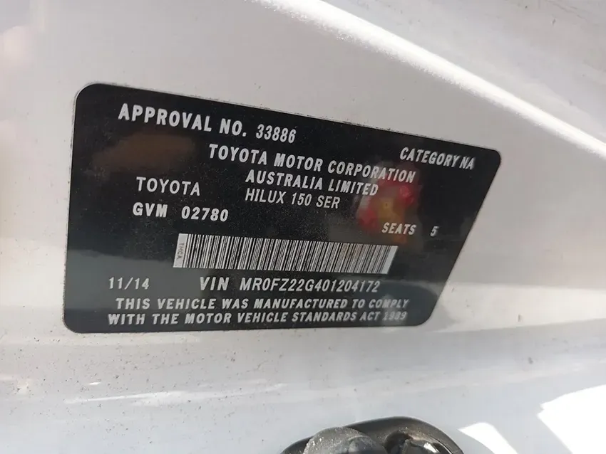 A Toyota Motor Corporation Approval Number is Shown on a White Car — South West 4WD Wreckers In Brisbane, QLD
