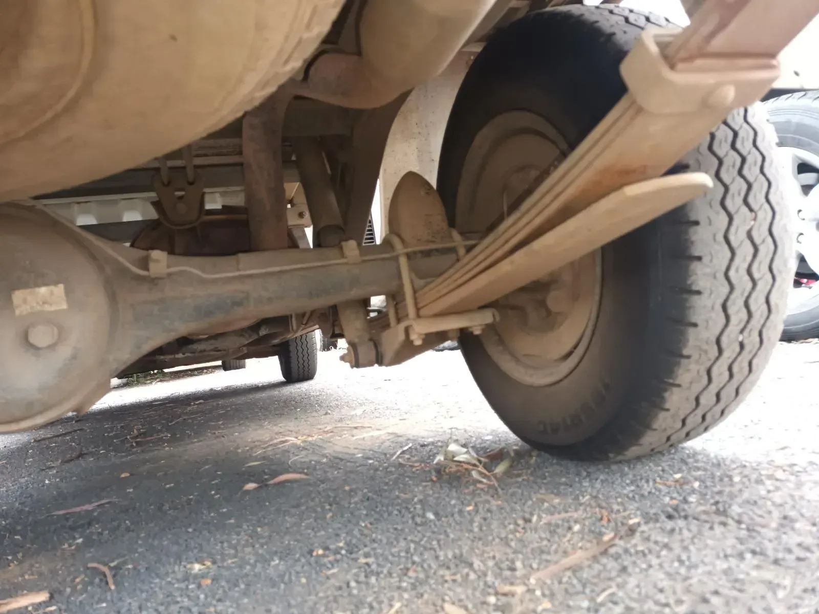 Underside of a Vehicle: Rear Axle, Leaf Springs, Tyre, and Exhaust — South West 4WD Wreckers In Brisbane, QLD