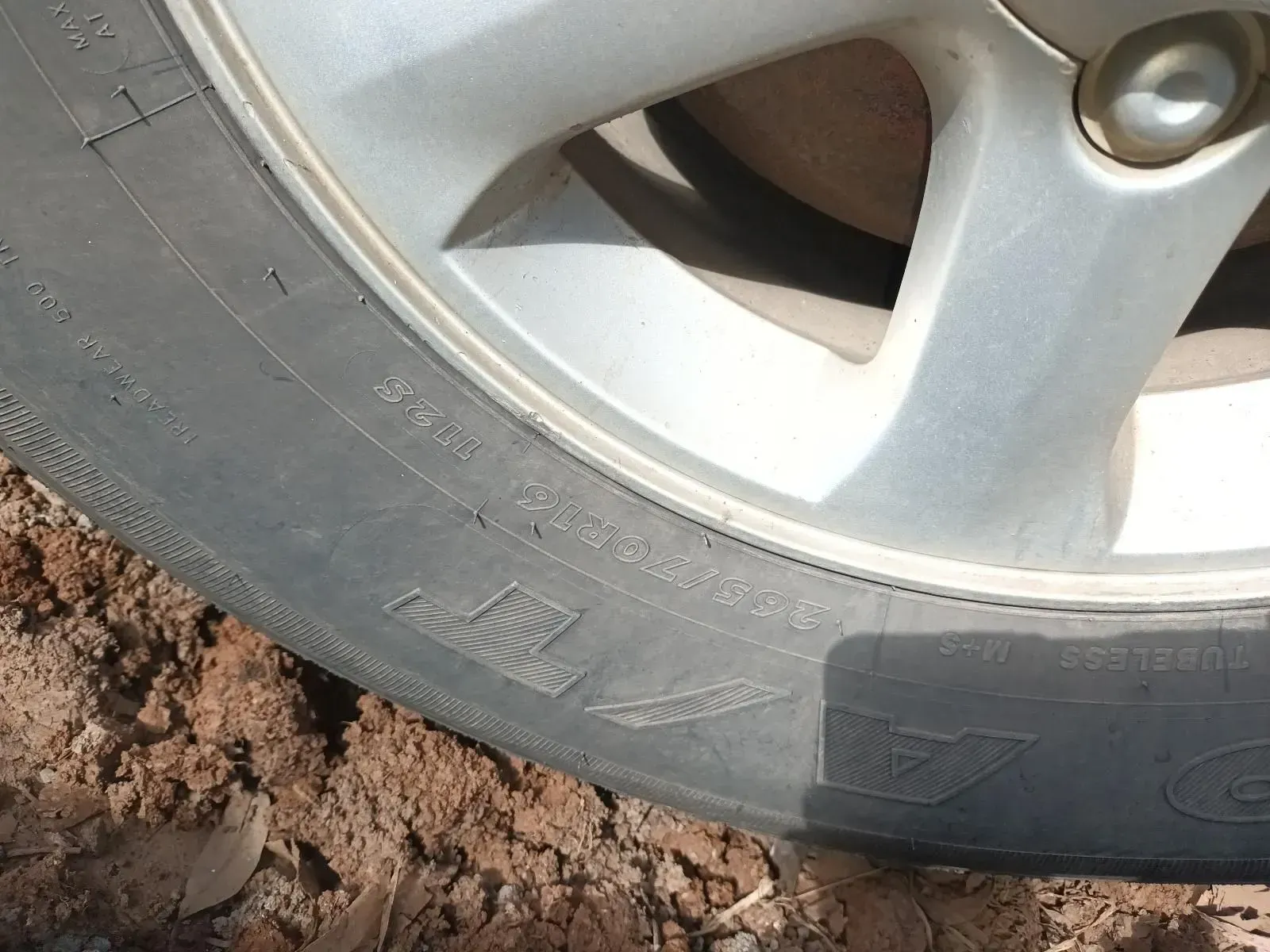 Close-up of a Car Tyre and Silver Wheel Rim, With Tyre Tread Visible — South West 4WD Wreckers In Brisbane, QLD