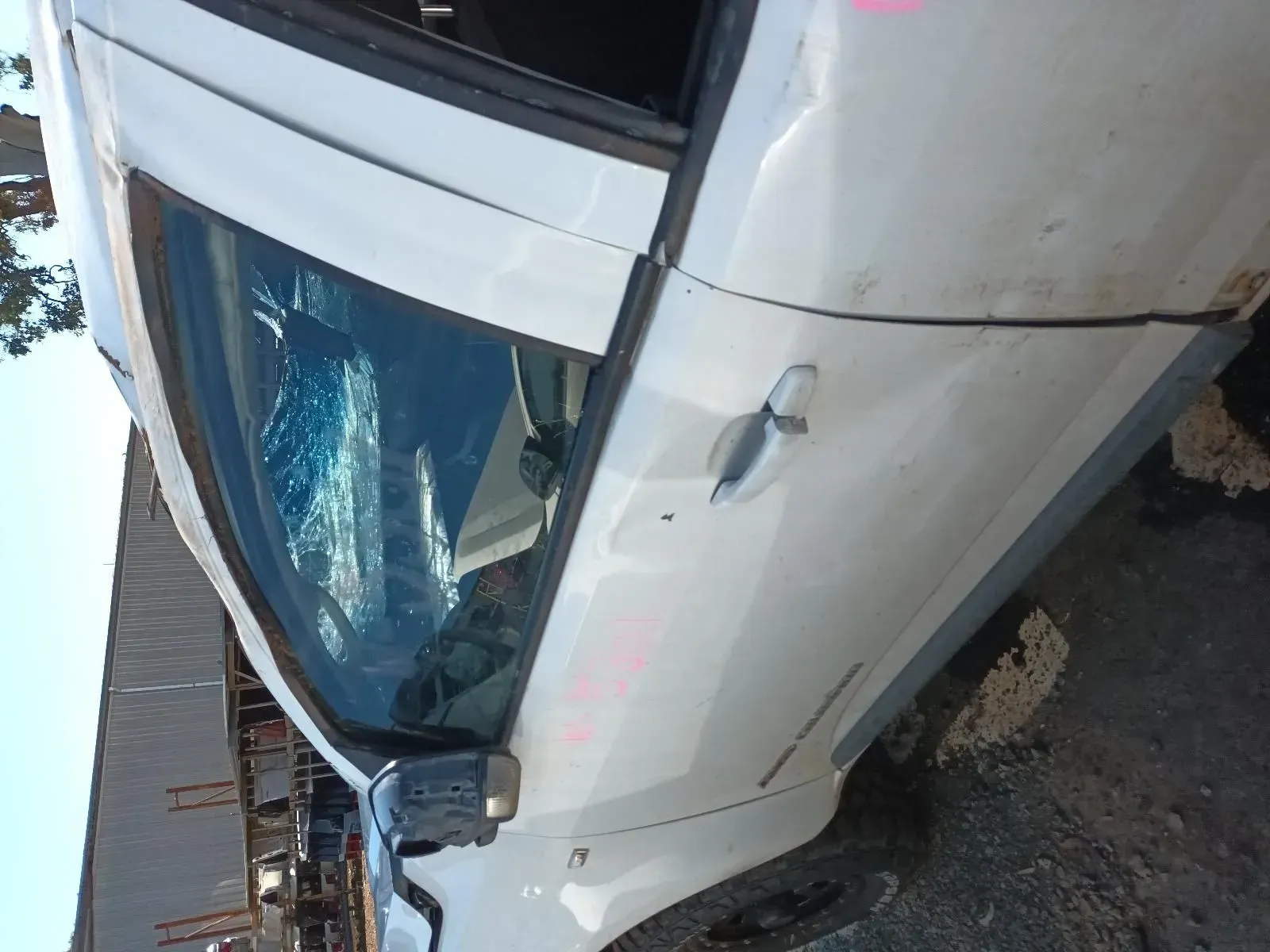 White Car With Shattered Window, Possibly in a Junkyard — South West 4WD Wreckers In Brisbane, QLD