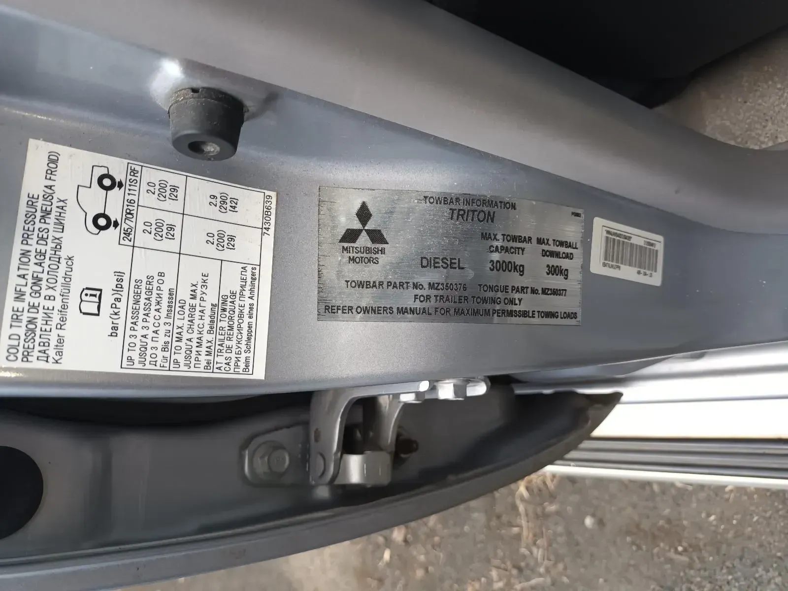 Labels on a Car Door Frame With Tyre Pressure and Vehicle Specifications — South West 4WD Wreckers In Brisbane, QLD