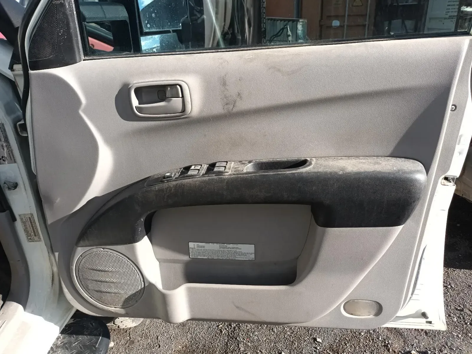 Beige Car Door Panel With Power Window Controls and a Speaker — South West 4WD Wreckers In Brisbane, QLD