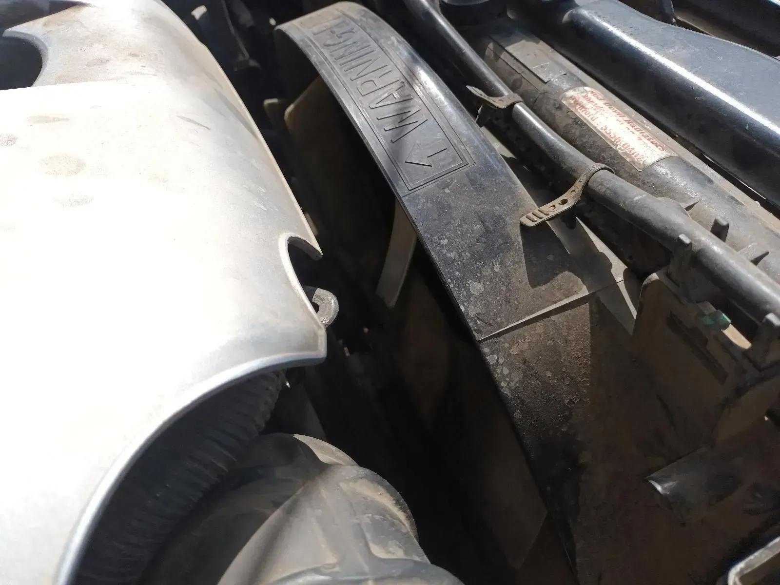 Engine Compartment Showing a Black Fan Belt and Surrounding Engine Components — South West 4WD Wreckers In Brisbane, QLD