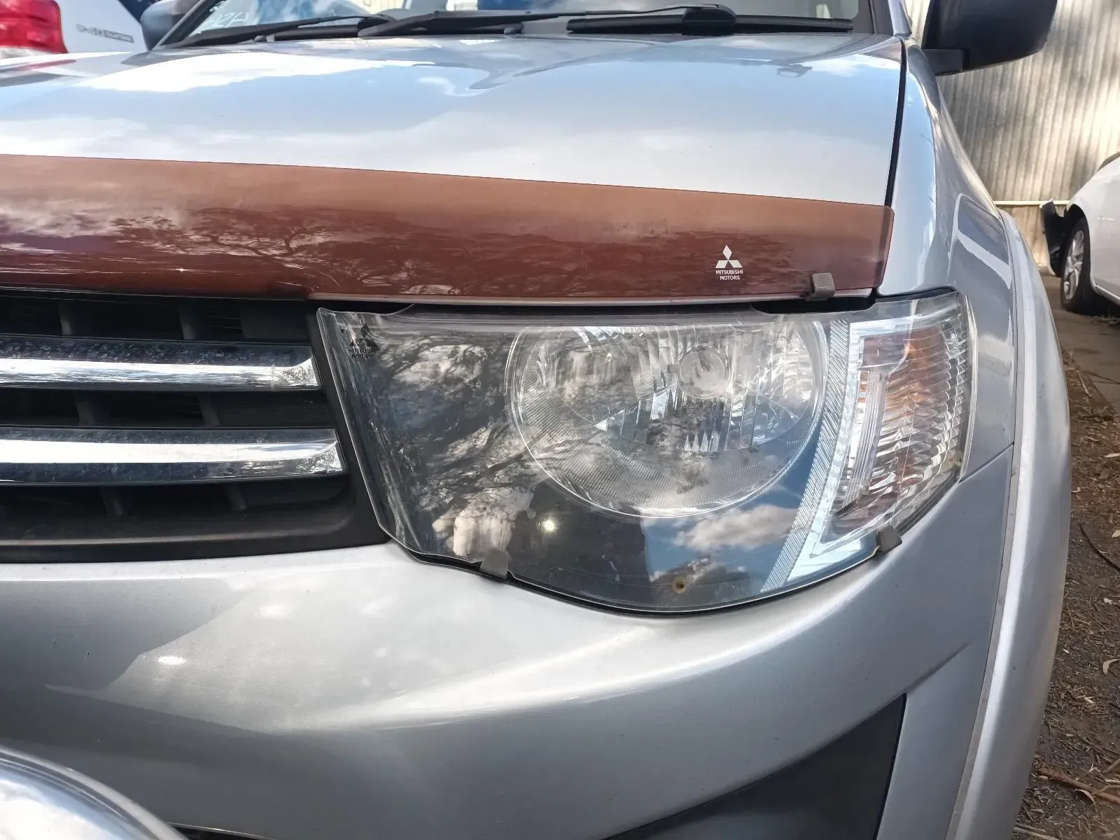 Silver Pickup Truck With a Brown Hood Deflector — South West 4WD Wreckers In Brisbane, QLD