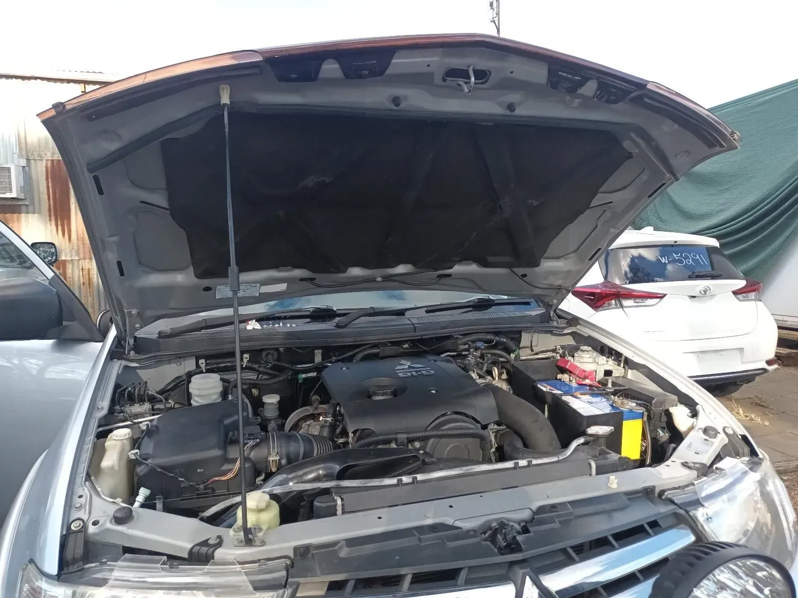 Silver Truck With Hood Open, Revealing Engine Components — South West 4WD Wreckers In Brisbane, QLD