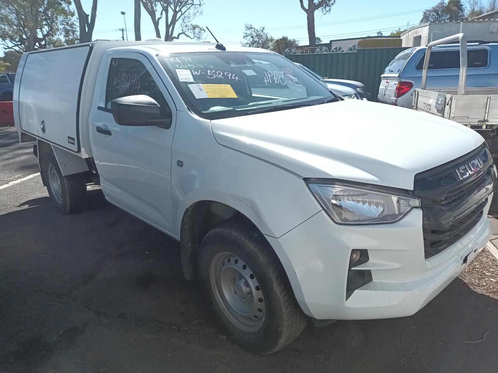 A Brown Isuzu Truck is Parked on the Side of the Road — South West 4WD Wreckers In Brisbane, QLD