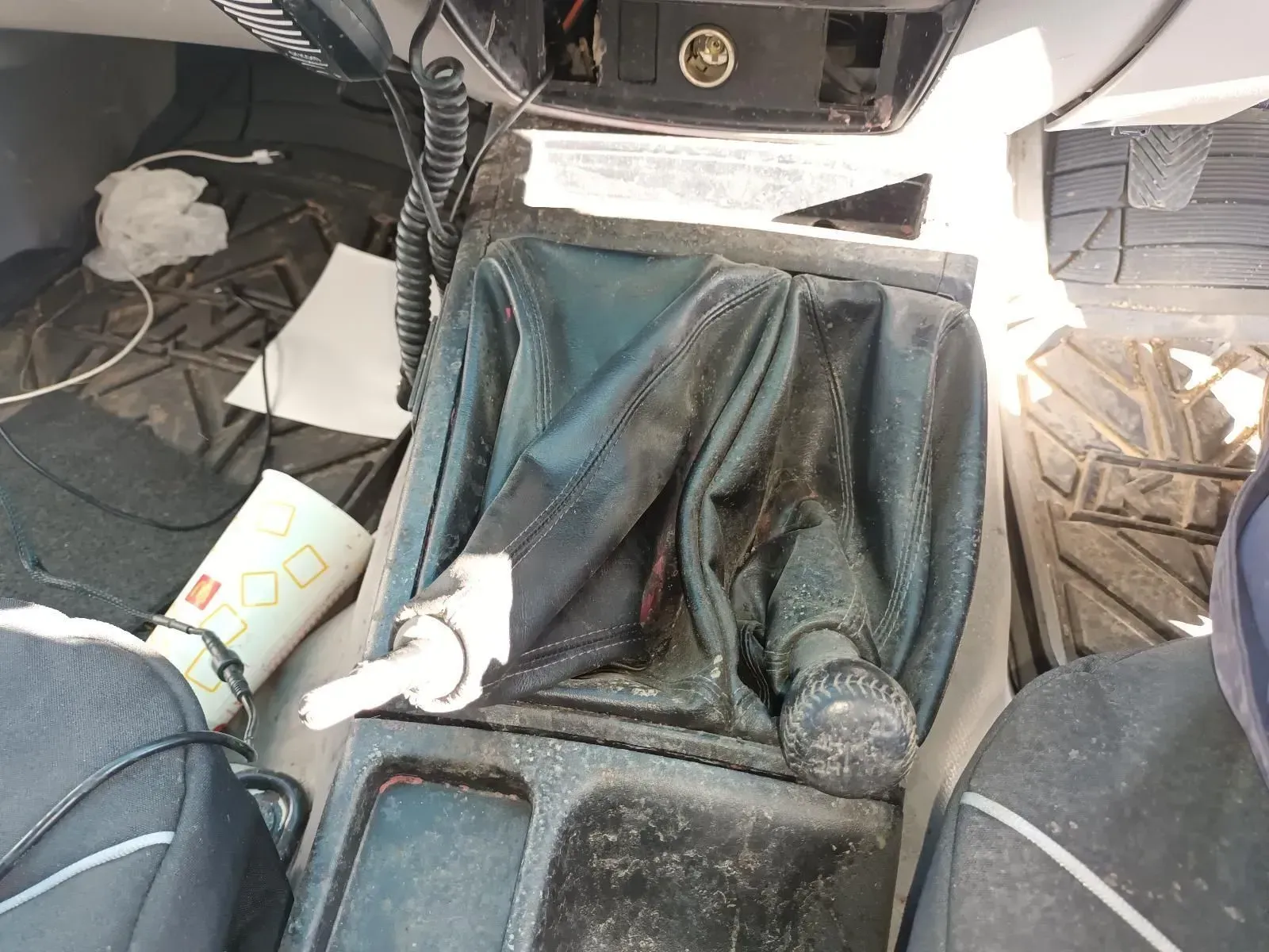 Interior Car View of Gear Shift and Console, Covered in Debris and Trash — South West 4WD Wreckers In Brisbane, QLD