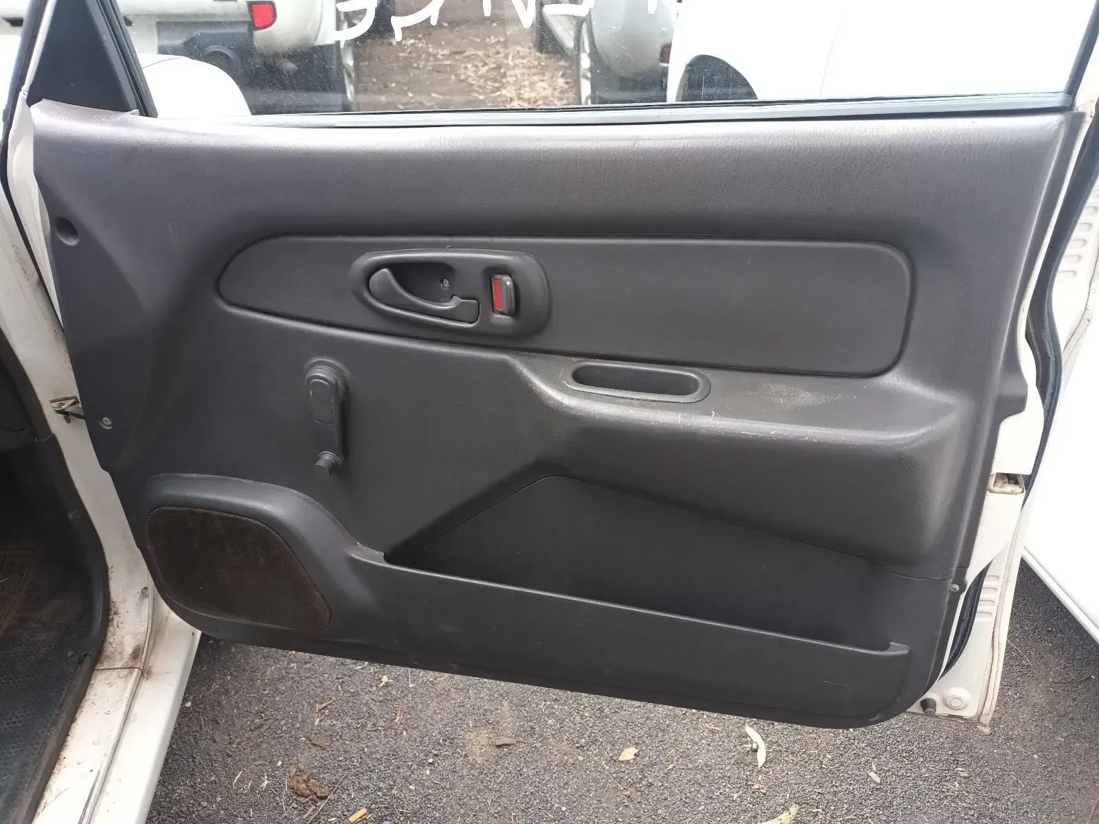 Dark Gray Car Door Interior With Handle, Pull, and Speaker Grill — South West 4WD Wreckers In Brisbane, QLD