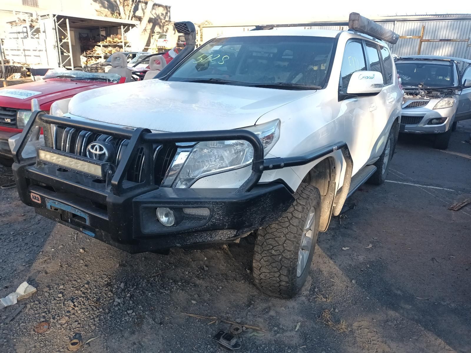 A White Truck With the Hood Up is Sitting in a Parking Lot — South West 4WD Wreckers In Brisbane, QLD