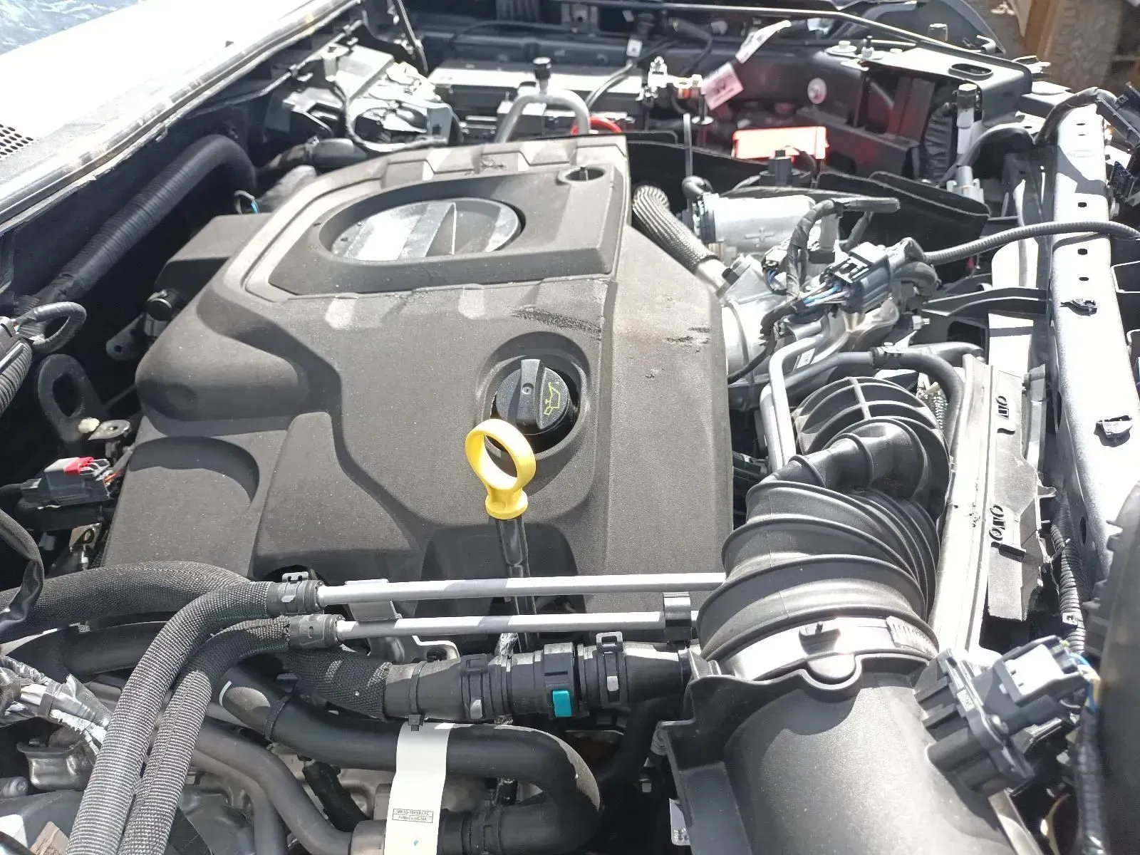 Black Car Engine With a Yellow Dipstick — South West 4WD Wreckers In Brisbane, QLD