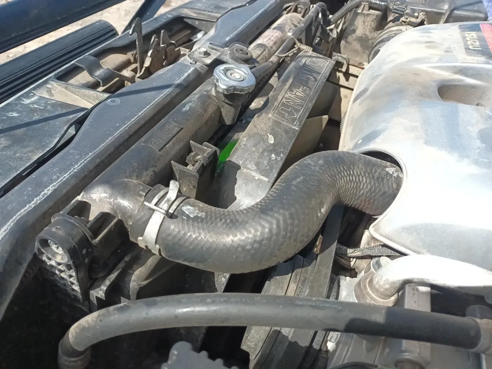 Car Engine With Black Hoses, Radiator, and Fan, Viewed From Above — South West 4WD Wreckers In Brisbane, QLD