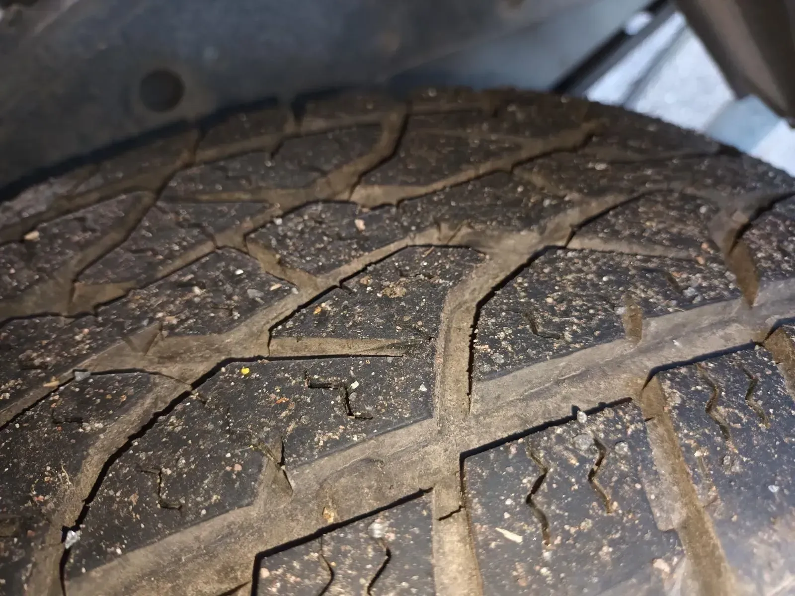 Close-up of a Car Tyre Tread, Showing Worn Rubber With Visible Dirt and Debris — South West 4WD Wreckers In Brisbane, QLD