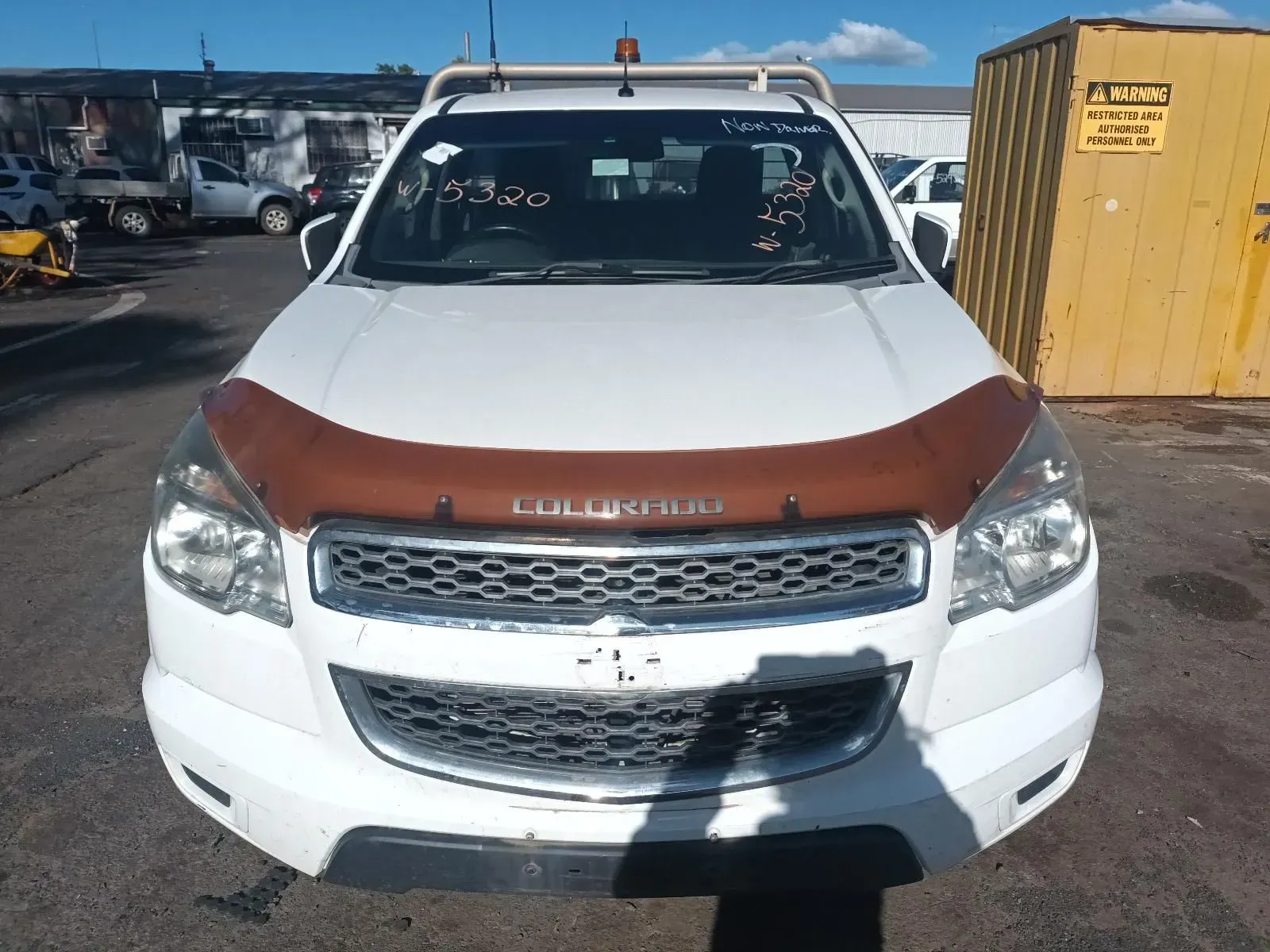 White Chevrolet Colorado Pickup Truck With a Brown Hood Protector — South West 4WD Wreckers In Brisbane, QLD