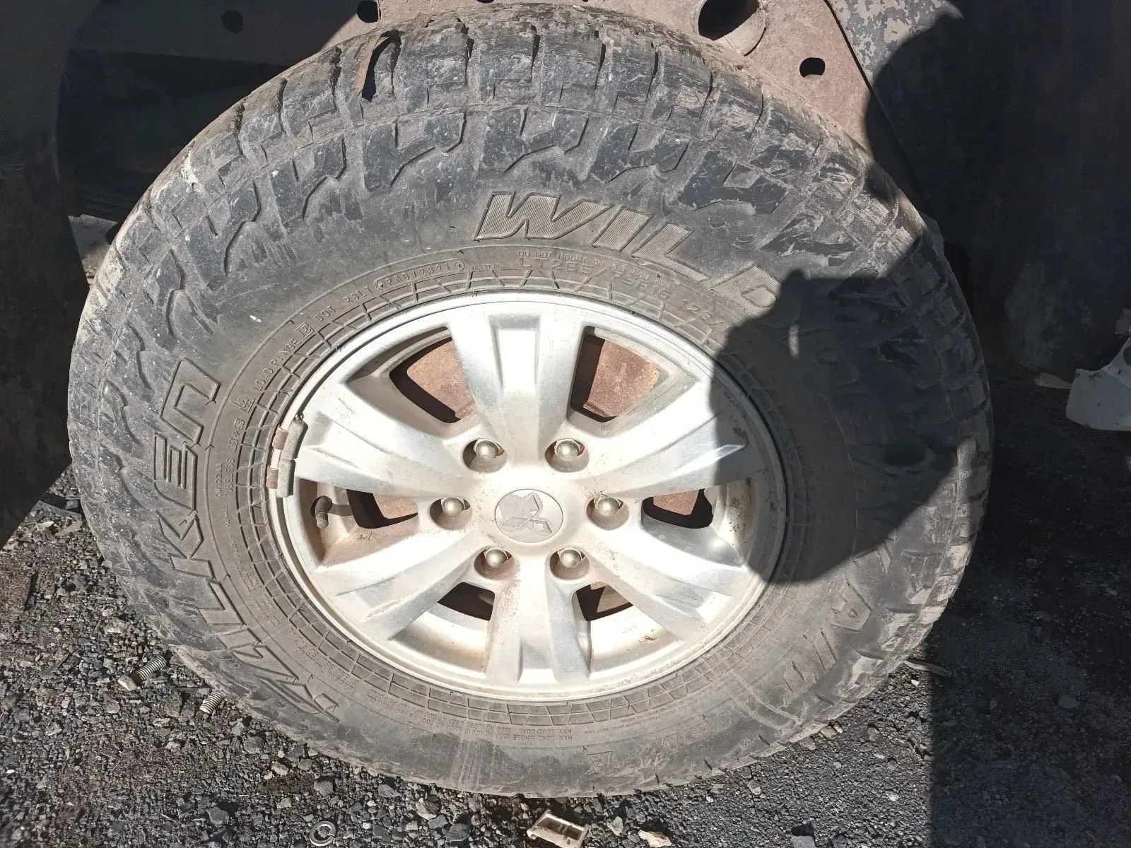 Close-up of a Worn Tyre and Silver Rim on a Vehicle — South West 4WD Wreckers In Brisbane, QLD