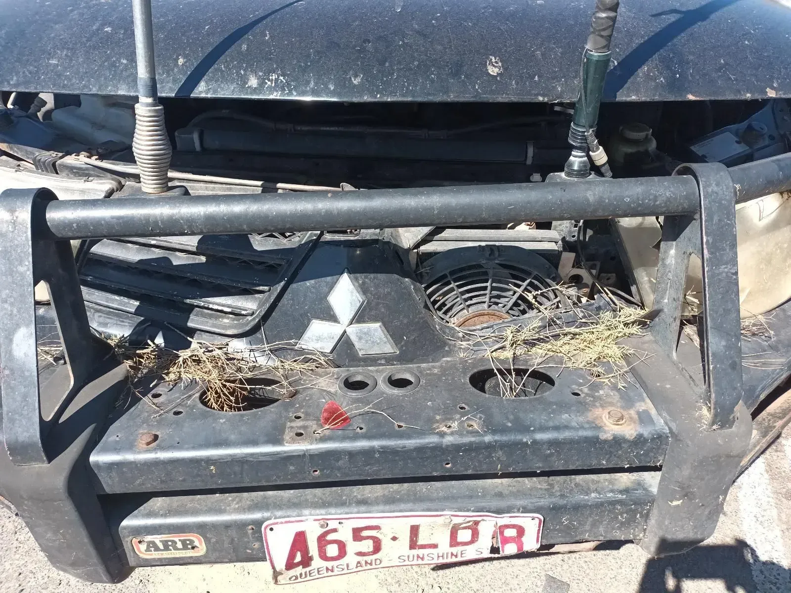 Front of a Black Mitsubishi 4x4 With an Arb Bumper — South West 4WD Wreckers In Brisbane, QLD
