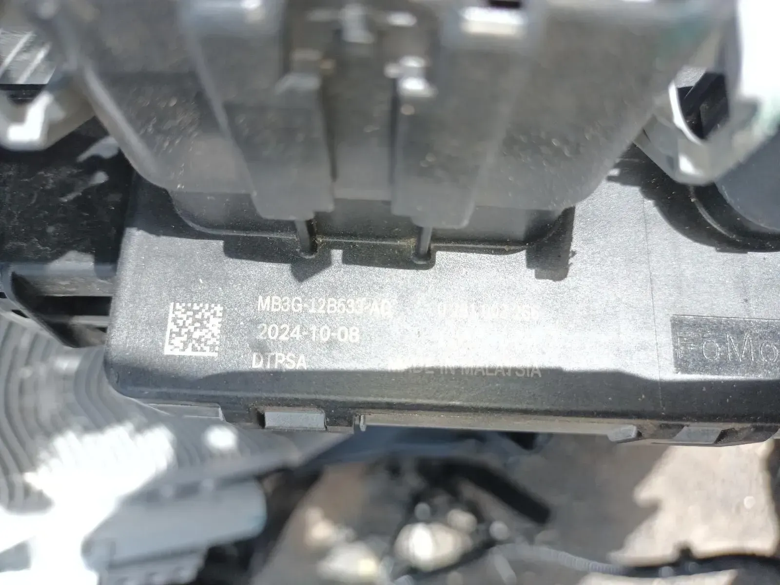 Close-up of a Black Electronic Component With Text and a Barcode — South West 4WD Wreckers In Brisbane, QLD