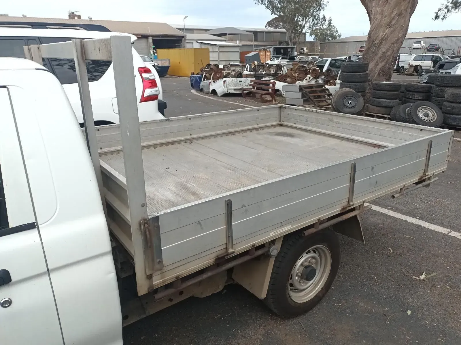 White Flatbed Truck in a Junkyard — South West 4WD Wreckers In Brisbane, QLD