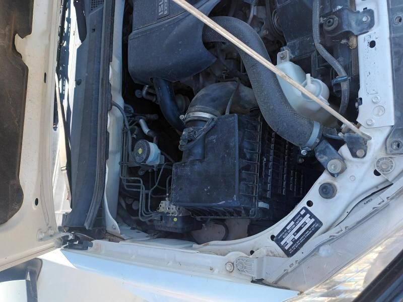 A Close Up of the Engine of a White Car — South West 4WD Wreckers In Brisbane, QLD
