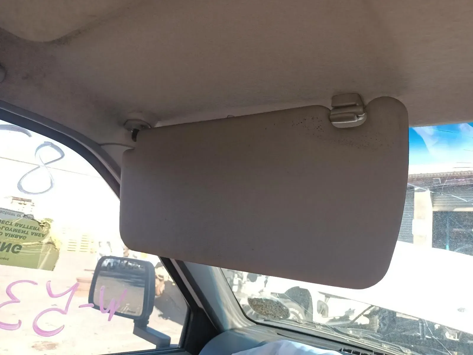 Tan Sun Visor in a Vehicle's Interior, Blocking the Windshield — South West 4WD Wreckers In Brisbane, QLD
