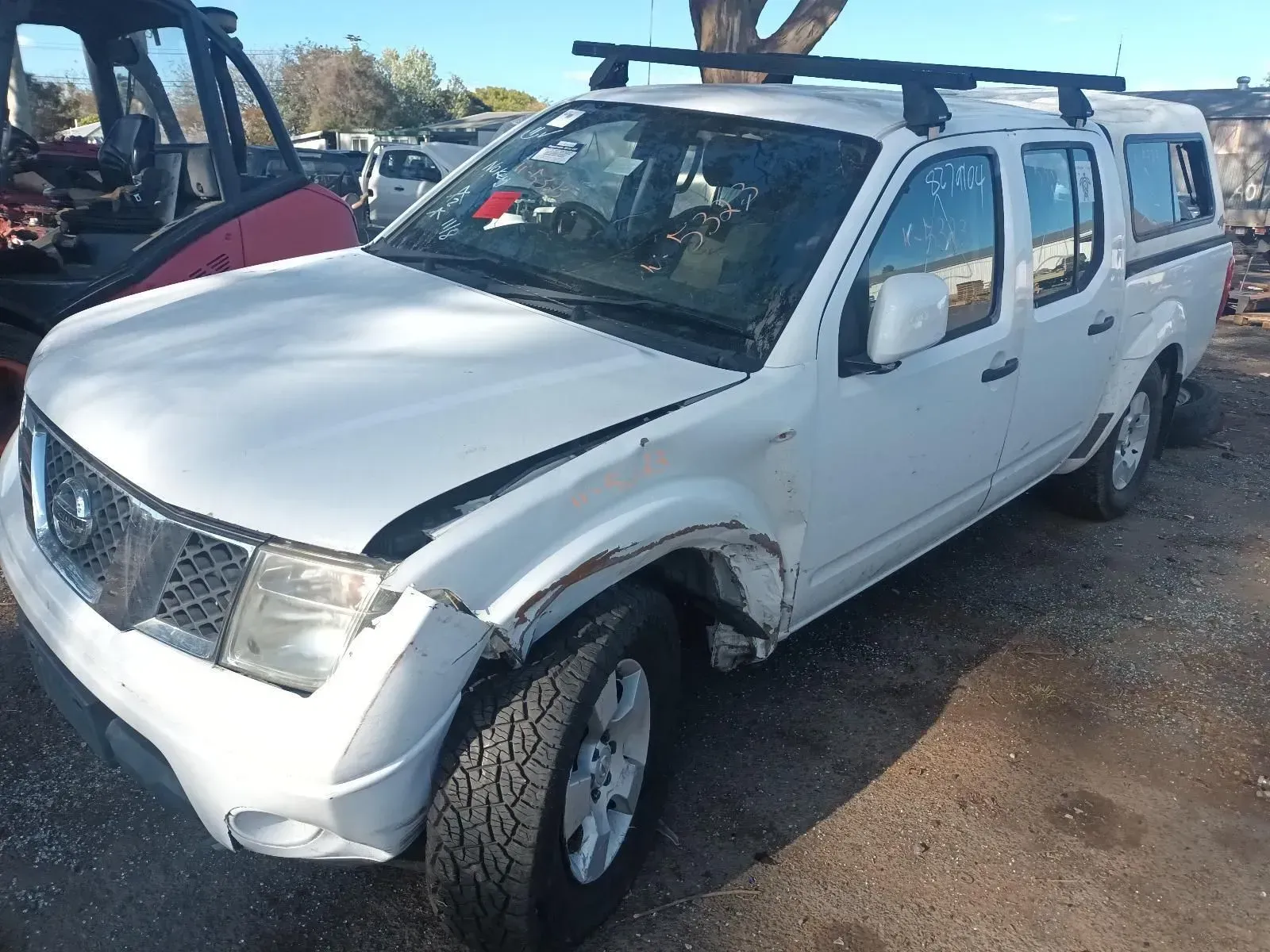 White Nissan Pickup Truck With Front-end Damage — South West 4WD Wreckers In Brisbane, QLD