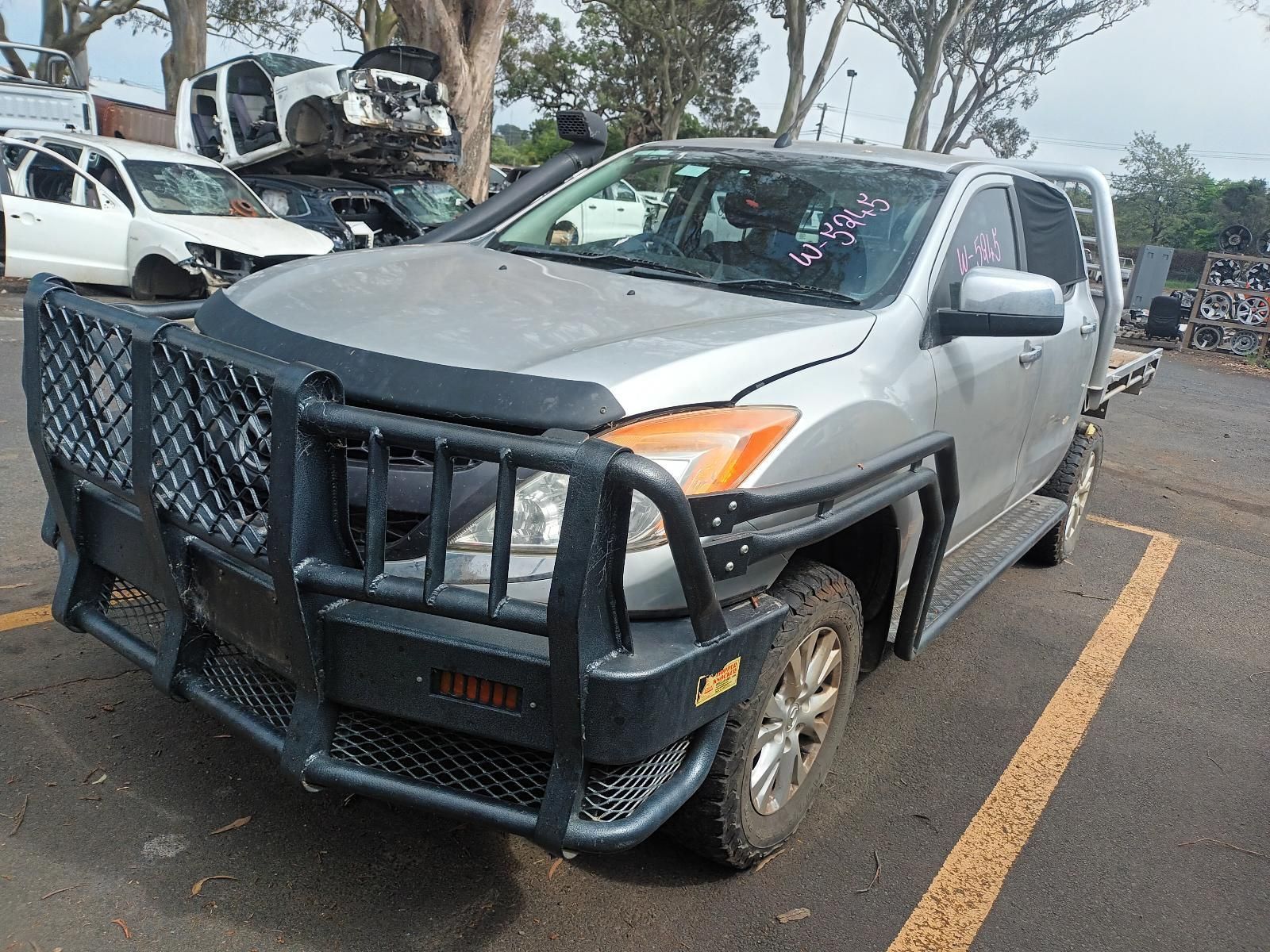 A Silver Truck With a Black Bumper is Parked in a Lot — South West 4WD Wreckers In Brisbane, QLD