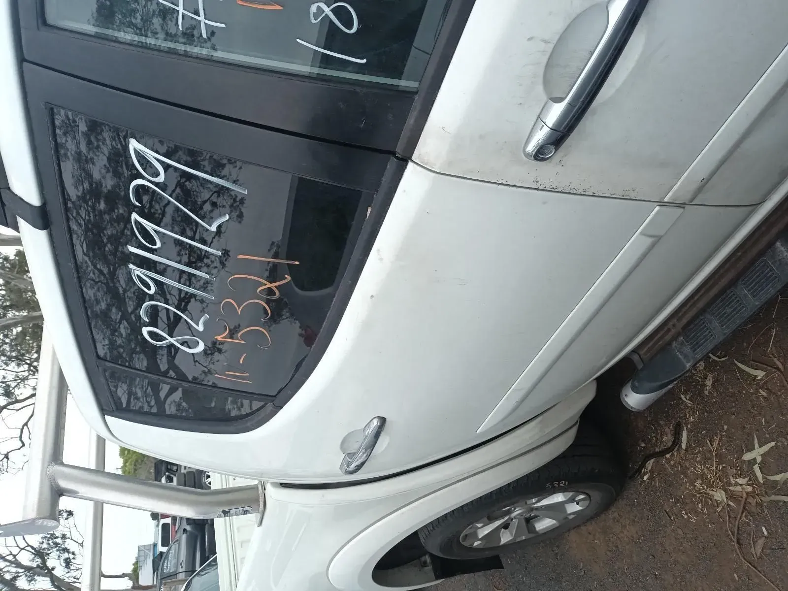 White Car Door With Price Markings on the Window — South West 4WD Wreckers In Brisbane, QLD