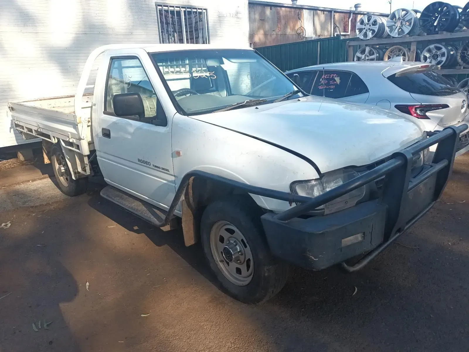 White Utility Truck in a Junkyard — South West 4WD Wreckers In Brisbane, QLD