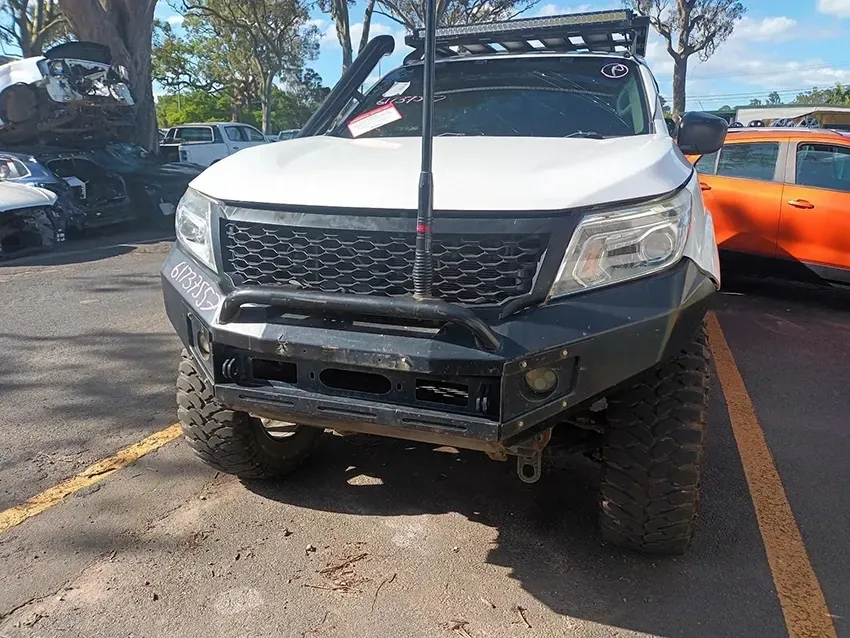 A White Truck with a Roof Rack is Parked in a Parking Lot — South West 4WD Wreckers In Brisbane, QLD