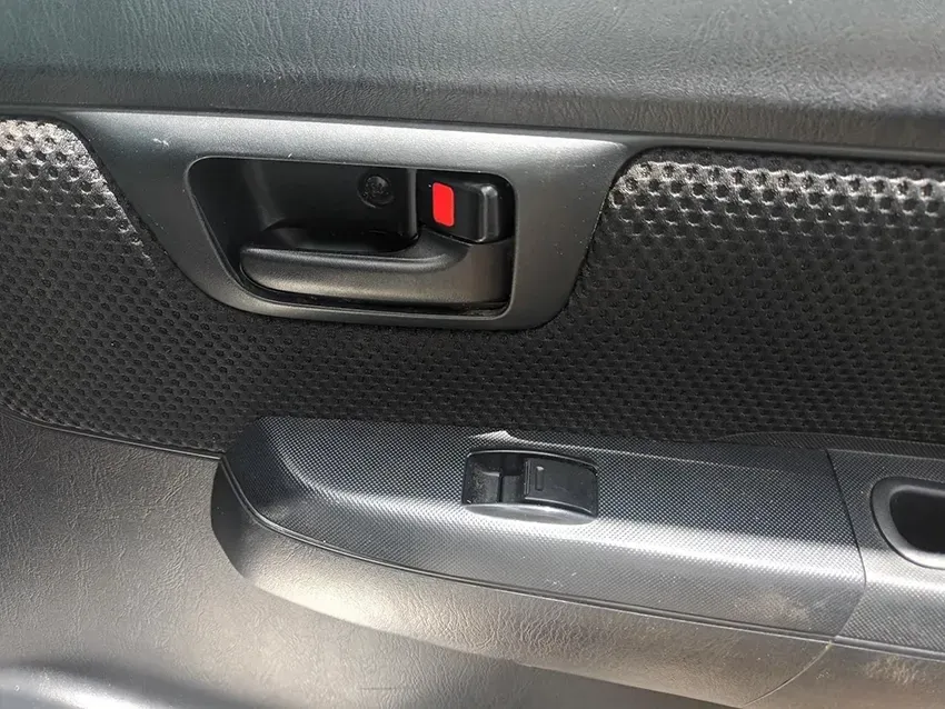 A Close Up of a Car Door Handle with a Red Button on It — South West 4WD Wreckers In Brisbane, QLD
