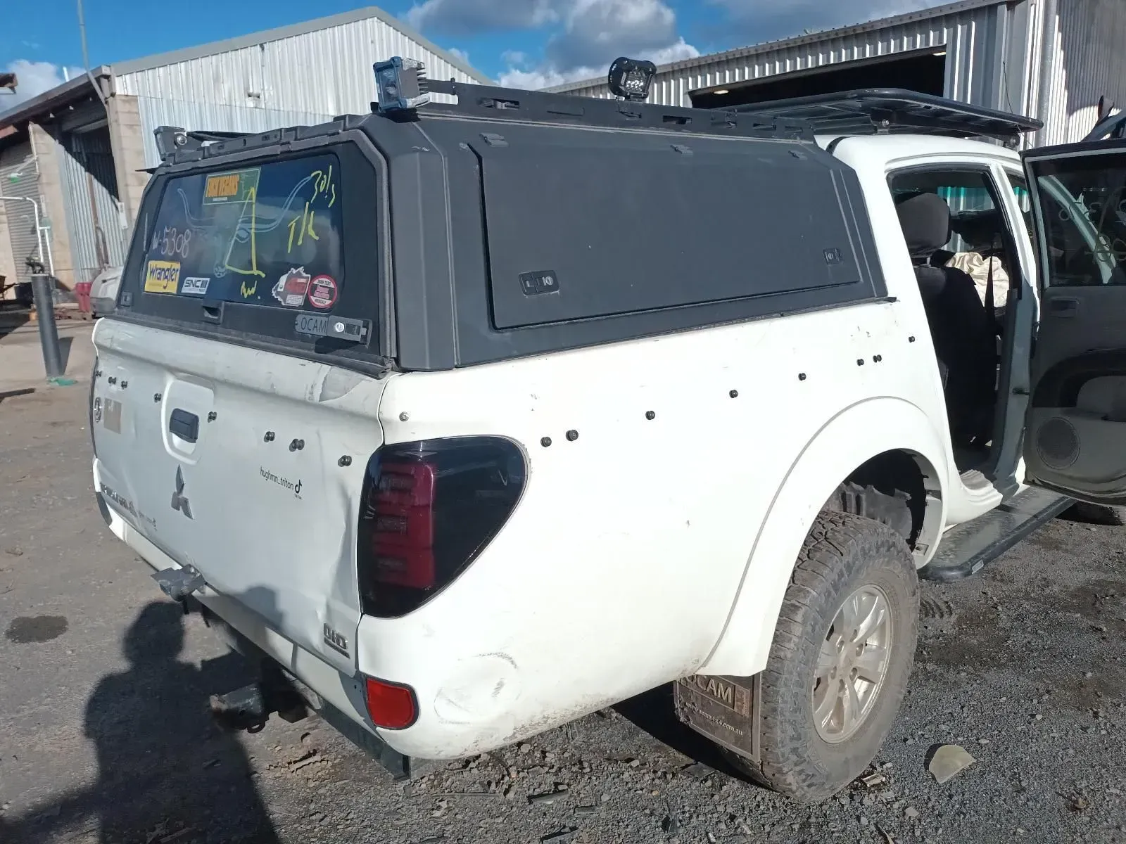 White Mitsubishi Triton Pickup Truck With a Black Canopy — South West 4WD Wreckers In Brisbane, QLD