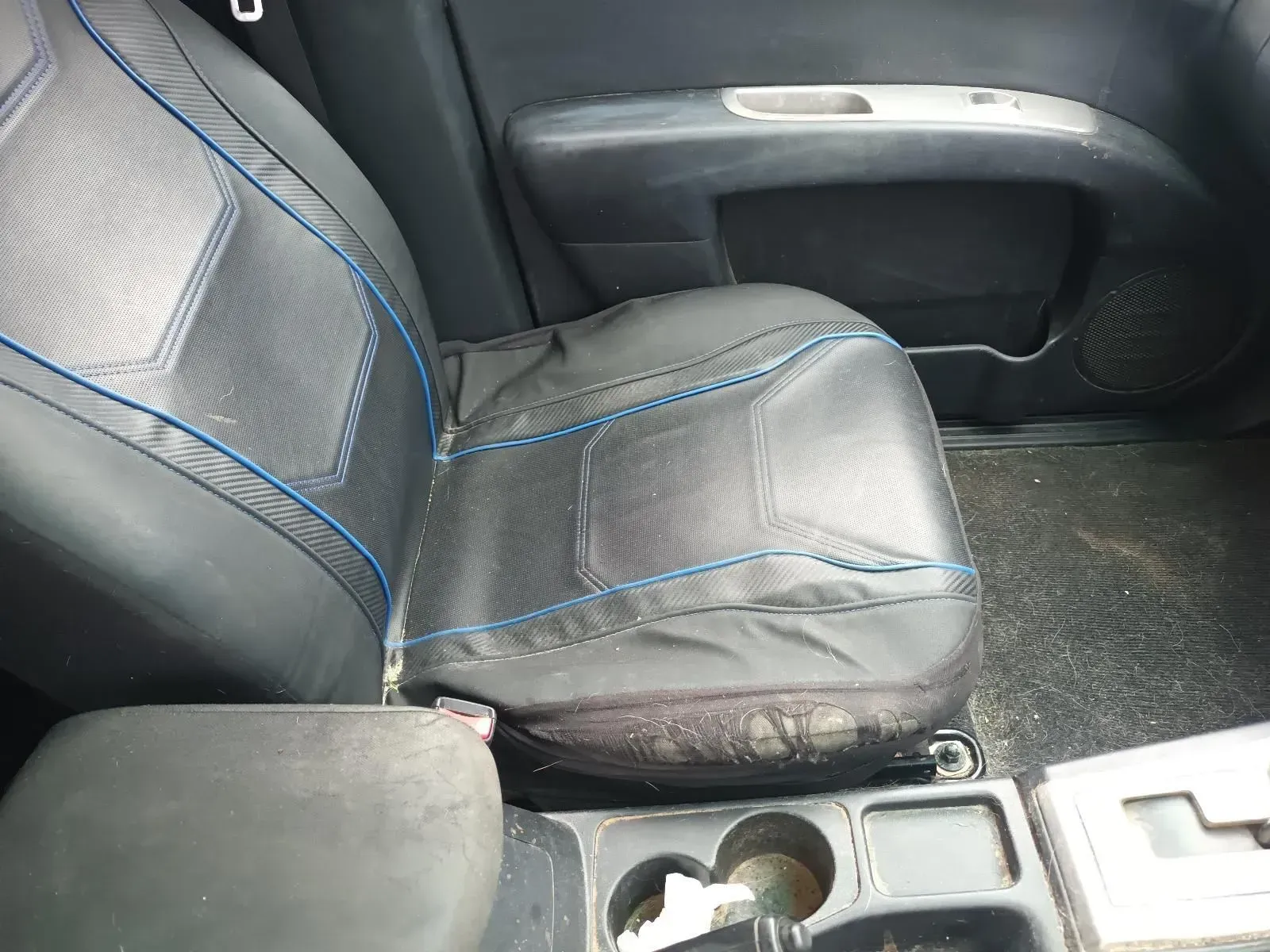 Black Car Seat With Blue Stitching; Center Console With Cup Holders — South West 4WD Wreckers In Brisbane, QLD
