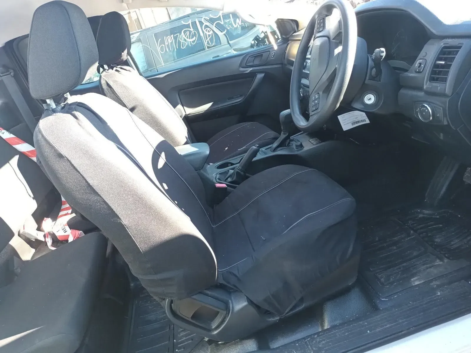 Interior of a Ford Ranger Pickup Truck With Black Seat Covers — South West 4WD Wreckers In Brisbane, QLD