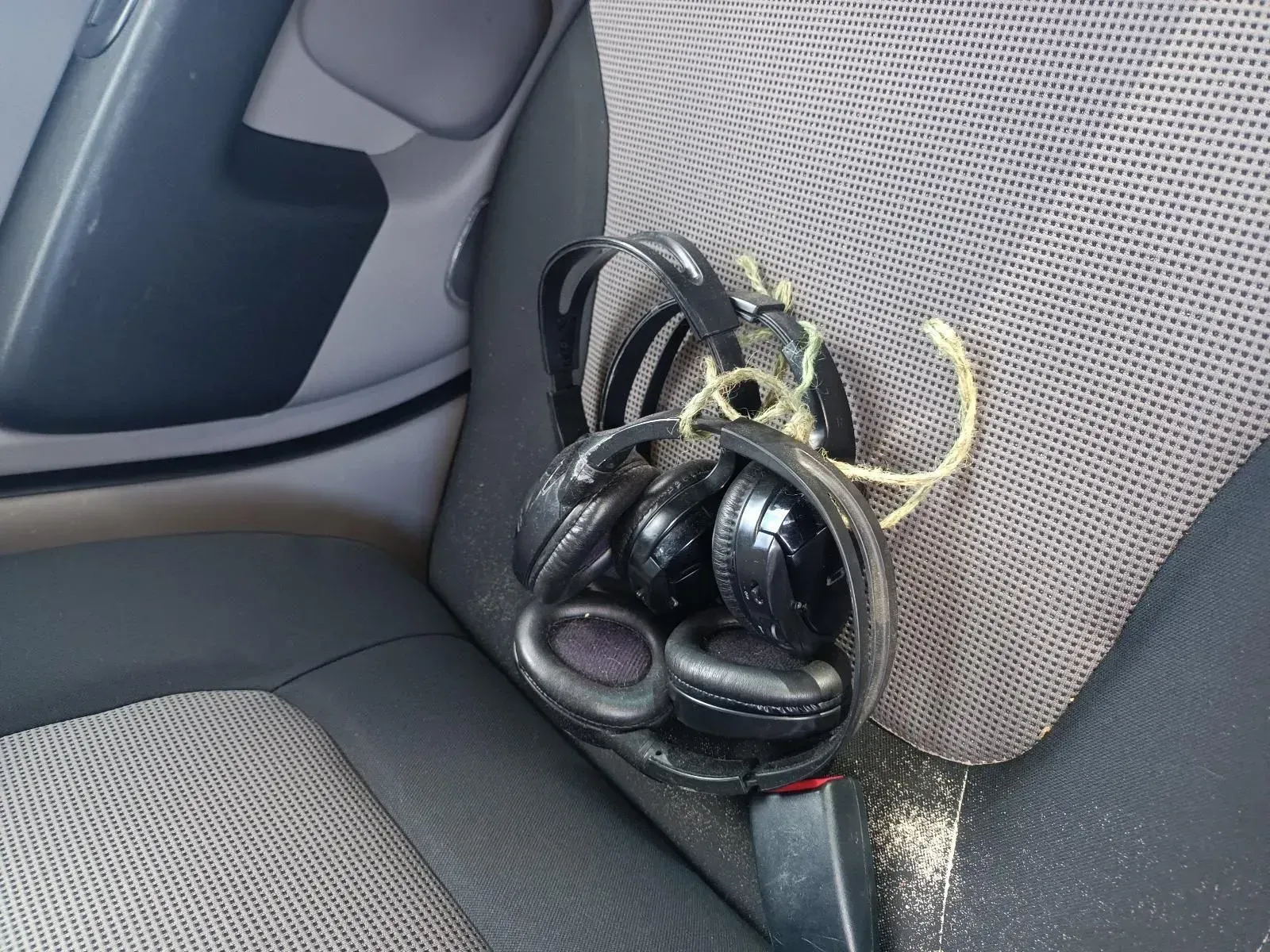 Black Headphones Tied Together, Sitting on a Car Seat — South West 4WD Wreckers In Brisbane, QLD