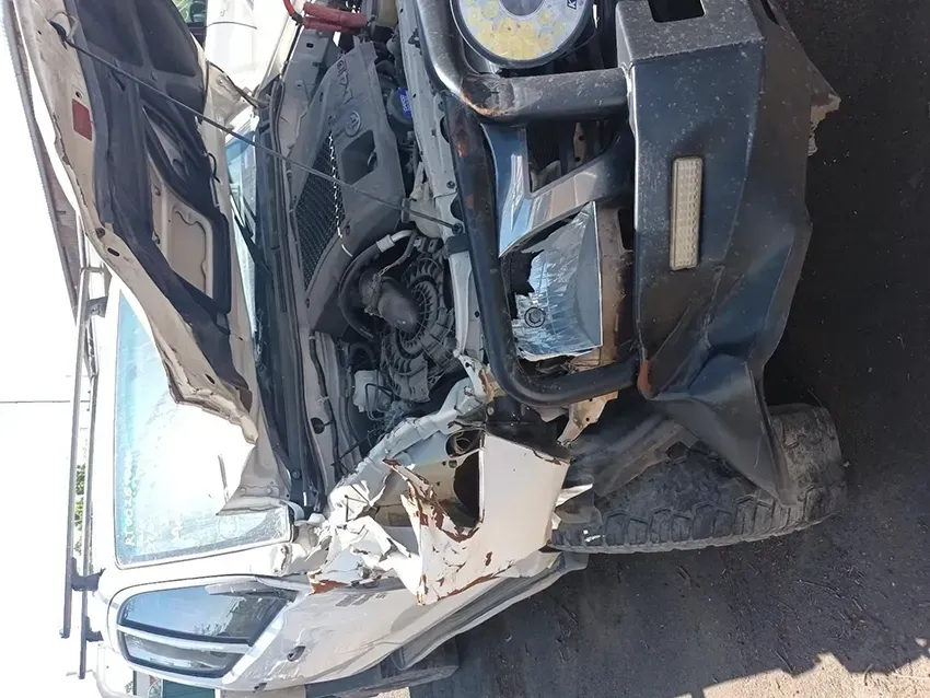 A Damaged Car With the Hood Open is Parked on the Side of the Road — South West 4WD Wreckers In Brisbane, QLD