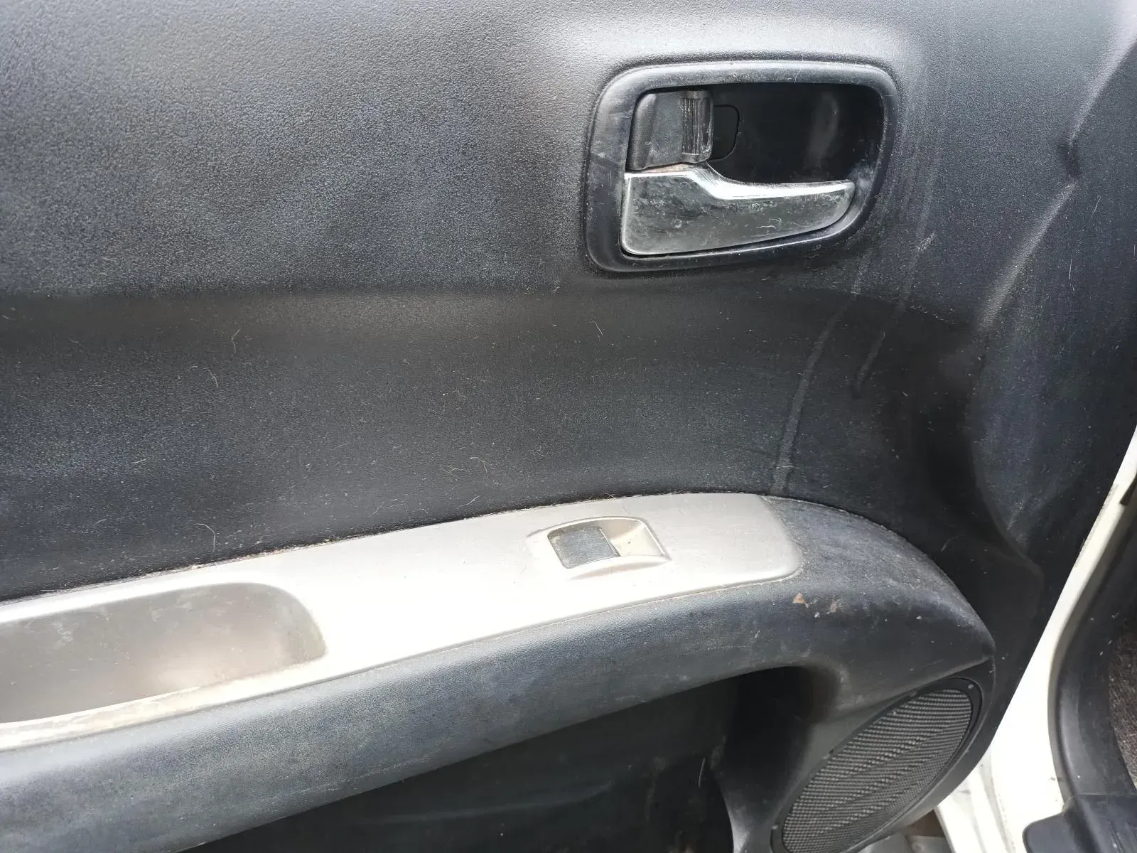 Car Door Interior, Showing Door Handle, Window Control, and Speaker — South West 4WD Wreckers In Brisbane, QLD
