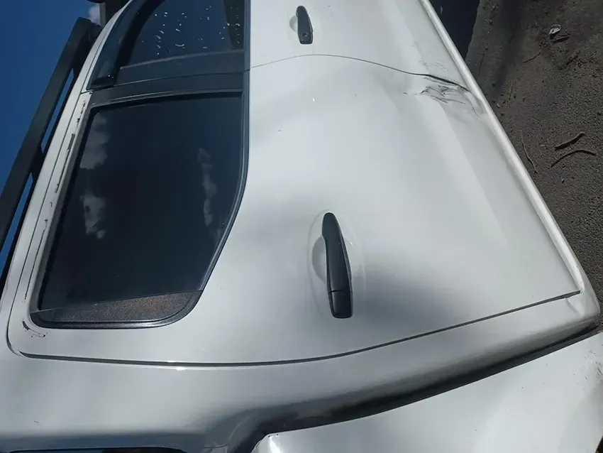 A White Car with a Black Antenna on the Roof — South West 4WD Wreckers In Brisbane, QLD