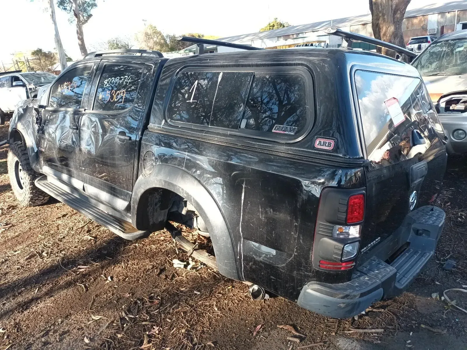 Black Pickup Truck With a Canopy Parked Outdoors in a Yard — South West 4WD Wreckers In Brisbane, QLD