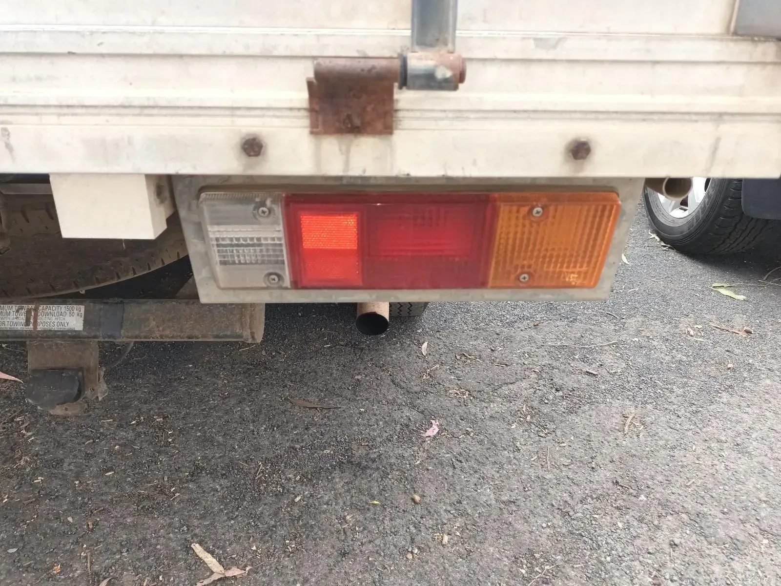 Rear of a White Truck With a Red and Orange Taillight — South West 4WD Wreckers In Brisbane, QLD