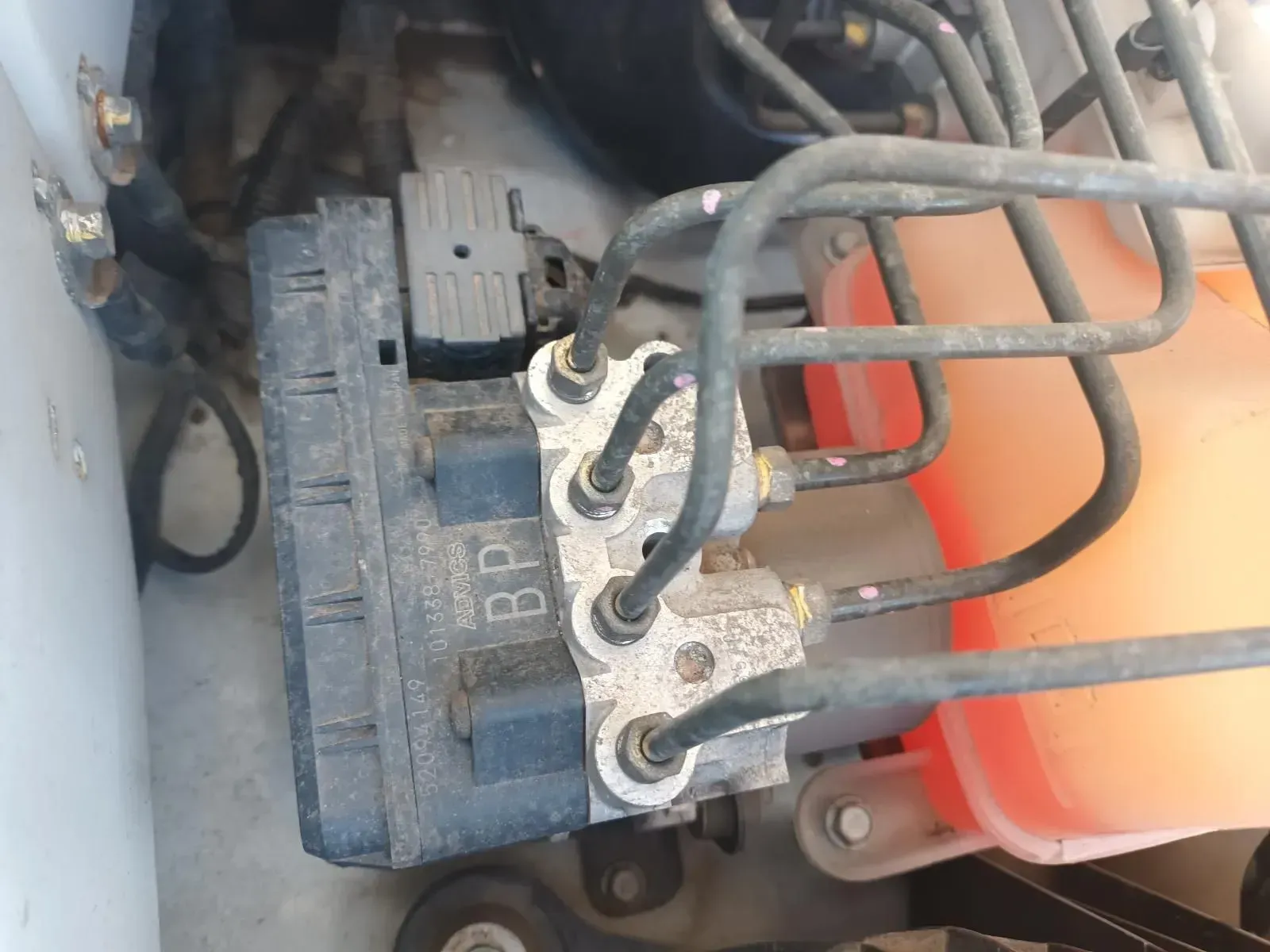 ABS Module With Brake Lines and Coolant Reservoir in a Car Engine Bay — South West 4WD Wreckers In Brisbane, QLD